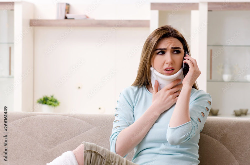 Young woman after car accident suffering at home Young woman after car accident suffering at home
