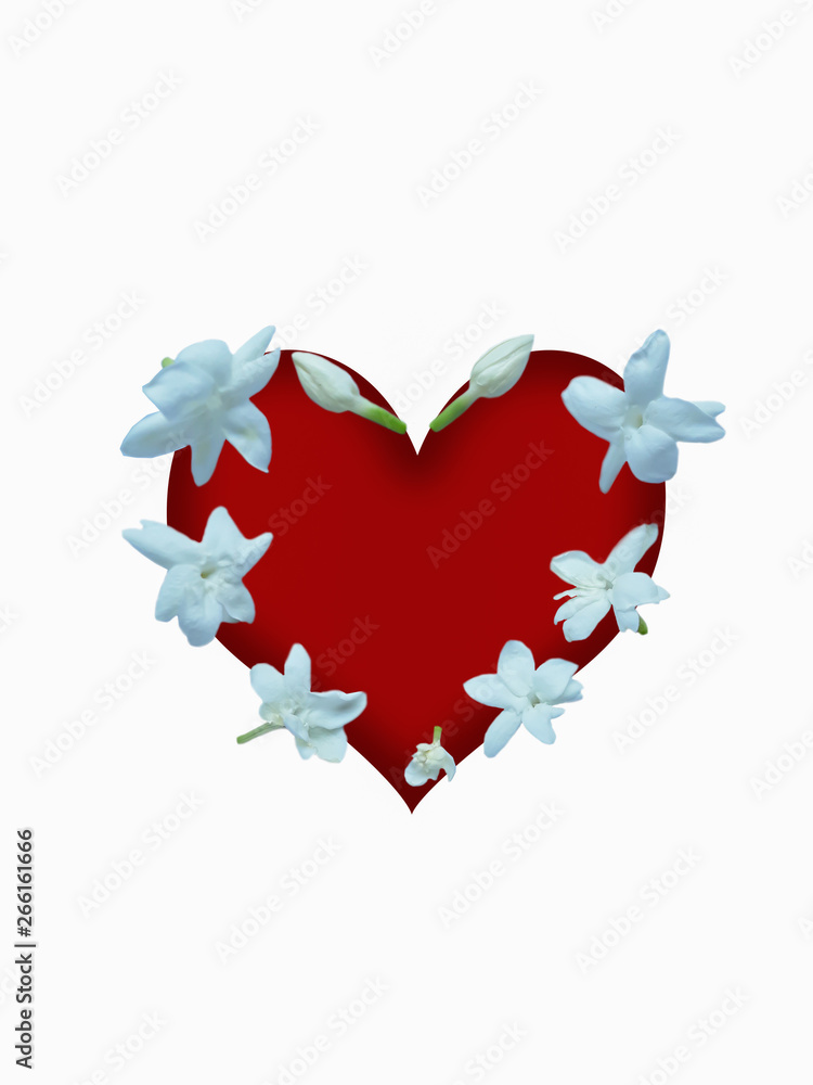 White jasmine arranged on a beautiful red heart background.