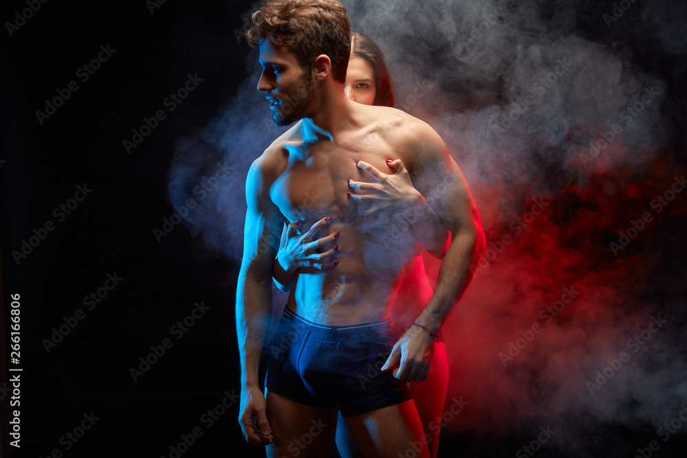 tender touch between man and woman. close up photo. isolated black background