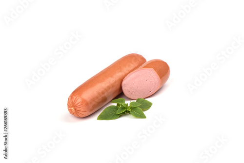 Two fresh boiled sausages with basil isolated on white background.