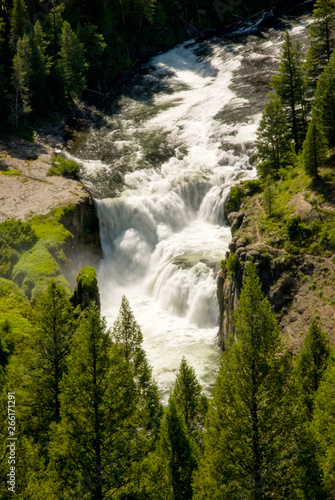 Wild Idaho river flows over a large water fall