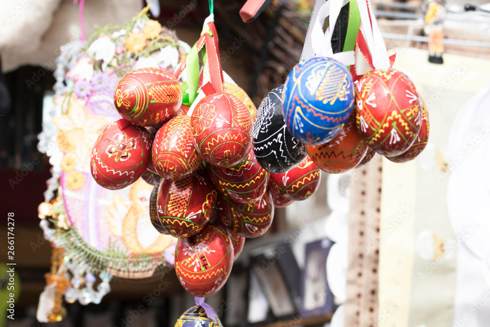 Colorfull decorated Easter Eggs hanging in ribbons