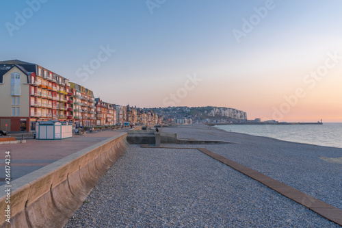 Mers-Les-Bains, France - 04 29 2019: Facades and cliffs along the dike at sunset © Franck Legros