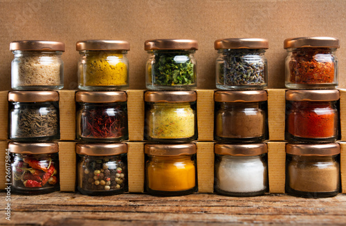 Large collection of spices in small jars photo