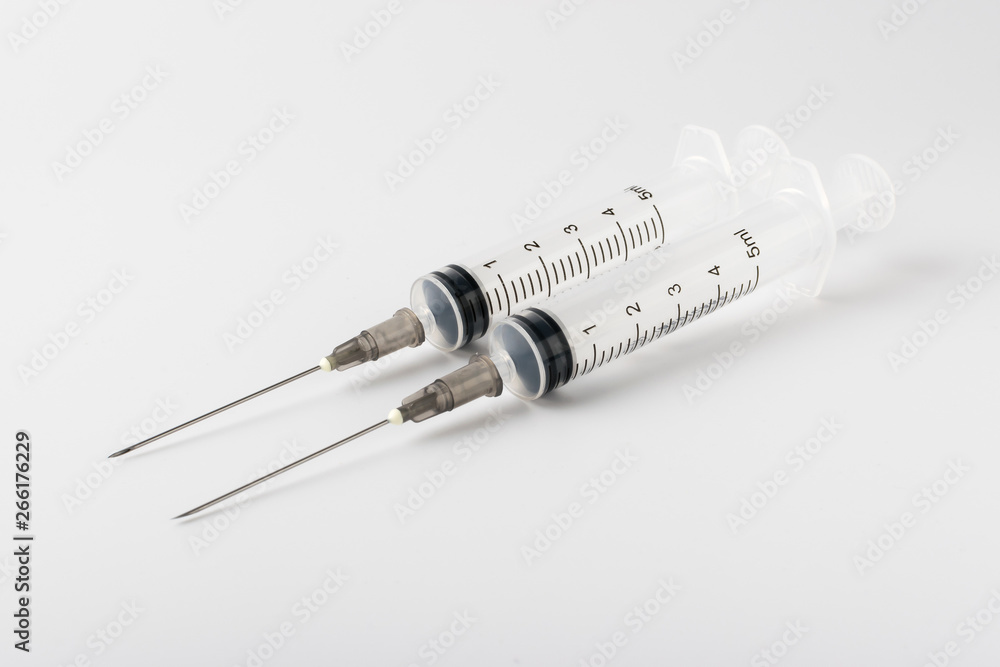 medical syringe with a long needle for the treatment of diseases and beauty shots on a white background medical syringe with a long needle for the treatment of diseases and beauty shots on a white background