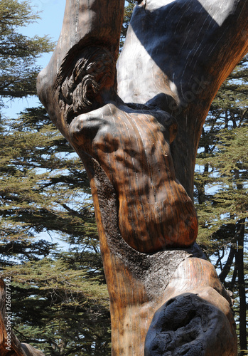 Wodden Christ sculpture in the cedar forest Arz er-Rabb in the lebanese mountains photo