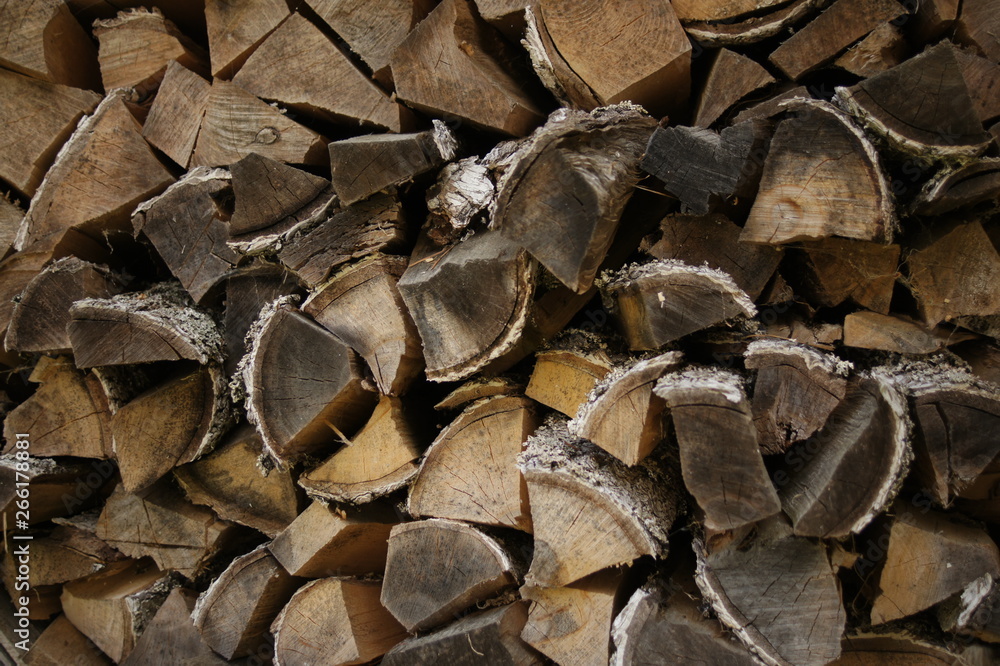 Firewood for the fireplace. Wooden logs, wood pile. Sawmill and planks. Firewood for the fireplace. Wooden logs, wood pile. Sawmill and planks.