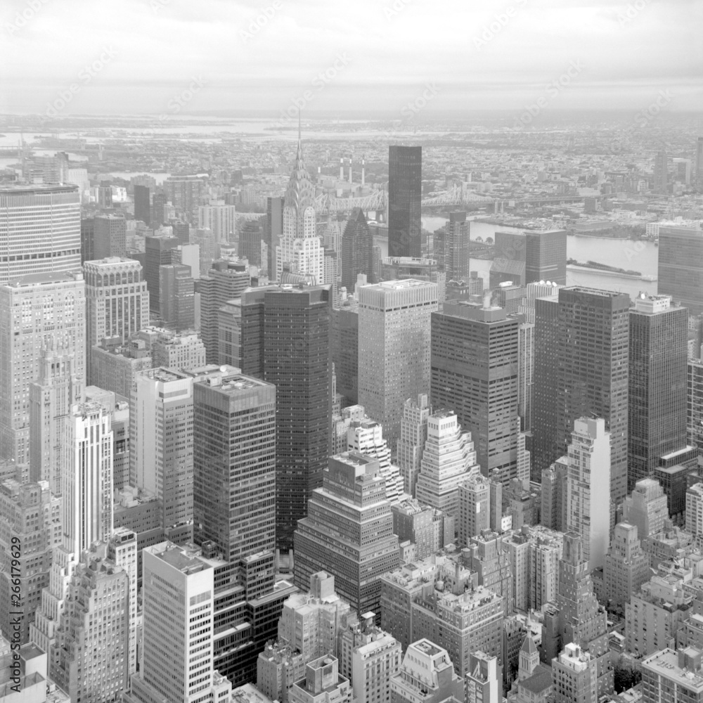 View of New York City Skyscrapers from the top of Empire State Building. Scanned film photo. Scanned black and white film photo. Captured with a medium format SLR camera from 1960s.