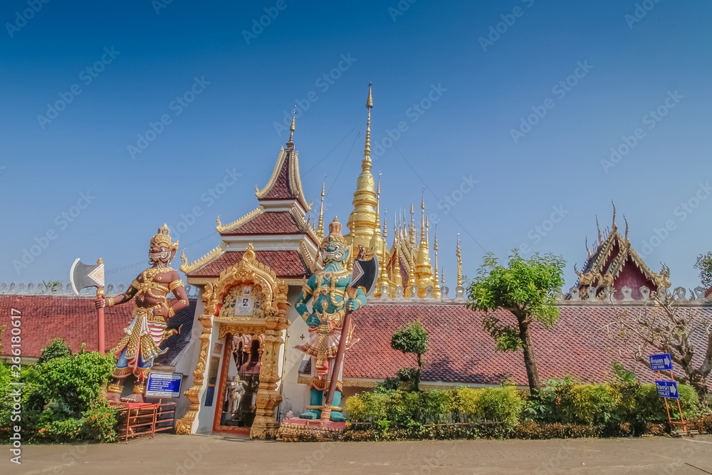 view of big Giant guardian in front of buddhist temple with blue sky background., famous attraction in Den Chai District, Phrae, northern of Thailand.