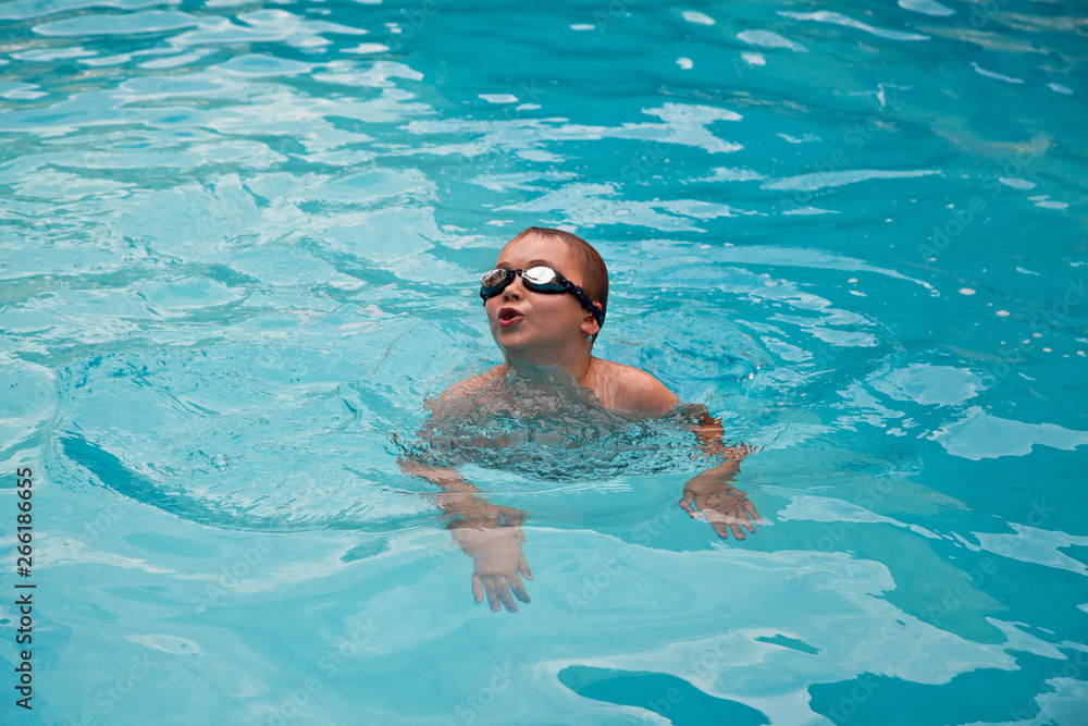Boy swimming in a pool