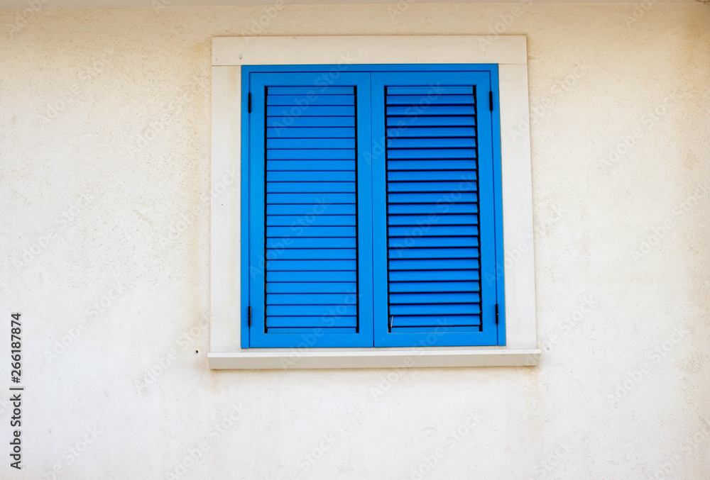 Blue window and white wall