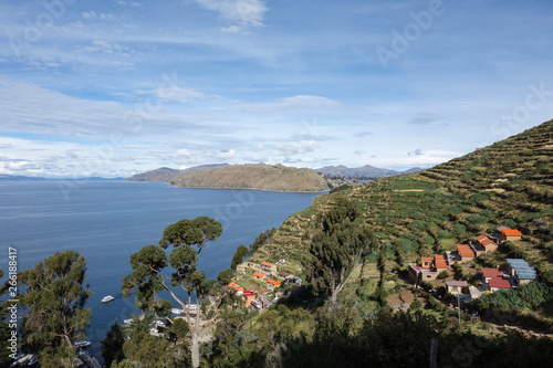 Panorama view with colrful houses and green terraces on the south coast of Isla del Sol, Boliva photo