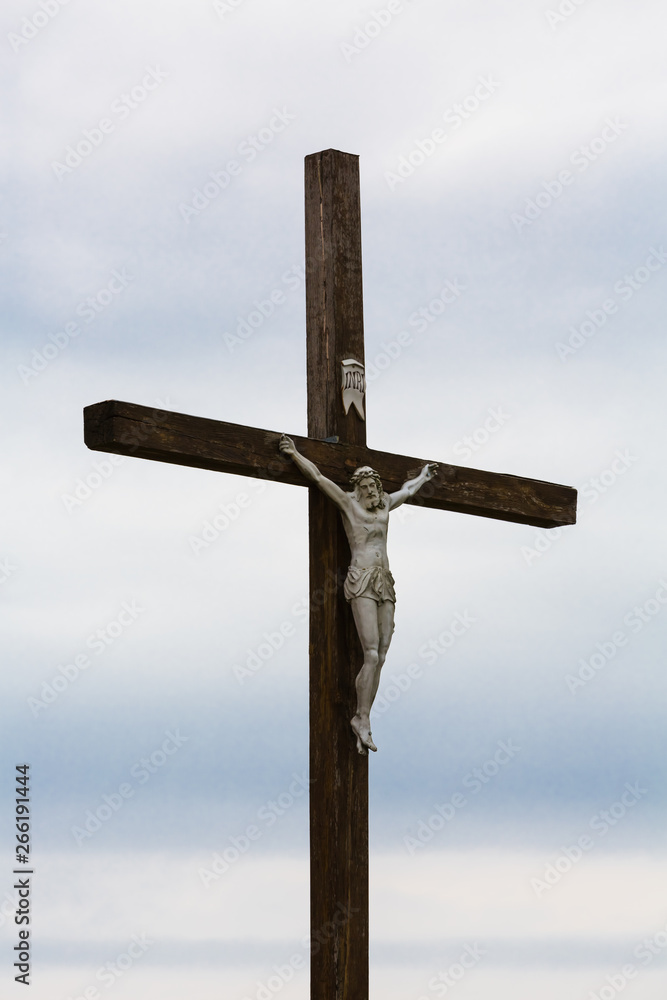 Fototapeta premium The image of a symbol of Jesus Christ on a wooden cross