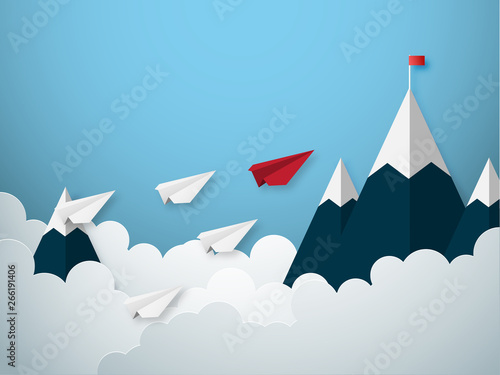 Leadership concept with red and white paper cut style airplane flying to goal flag on the mountain. © indysystem