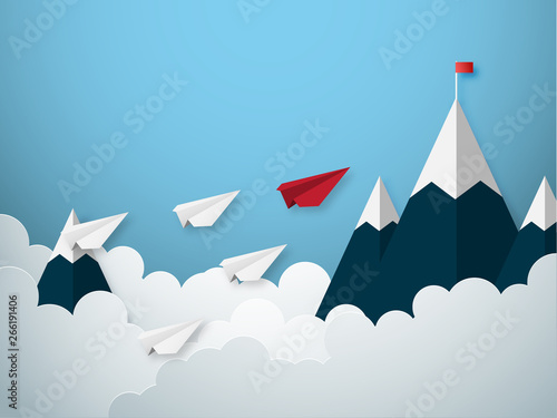 Leadership concept with red and white paper cut style airplane flying to goal flag on the mountain.