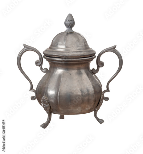 Vintage pewter sugar bowl with lid isolated on white background. Highly decorated, ornate.