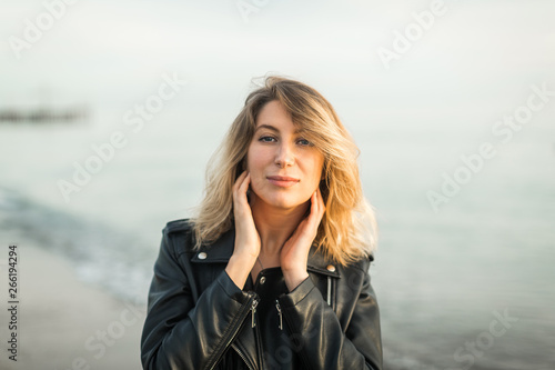 portrait of a beautiful woman against the sea © yuliasverdlova