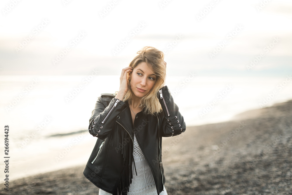 portrait of a beautiful woman against the sea portrait of a beautiful woman against the sea