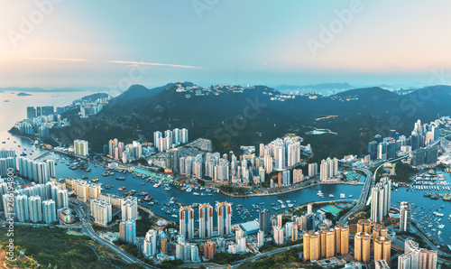Landscape from top view see the Floating House and local boat around Aberdeen bay estuary with Buildings at southern of Hong Kong