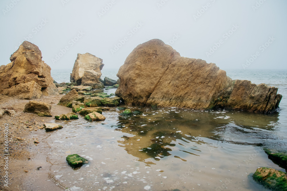 Beautiful wild Beach Fontanka near Odessa. Yellow and red sandstone cliffs are located on the seafront Beautiful wild Beach Fontanka near Odessa. Yellow and red sandstone cliffs are located on the seafront