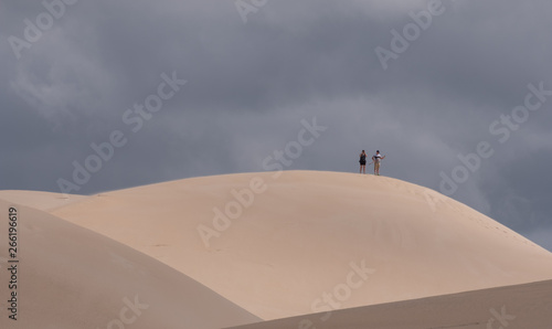People at the top of the dunes at the Alexandria coastal dune fields near Addo / Colchester on the Sunshine Coast in South Africa. 