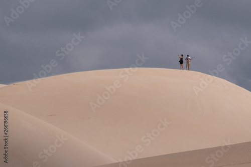 People in the distance atop the dunes in The Alexandria coastal dune fields near Addo / Colchester on the Sunshine Coast in South Africa. © Lois GoBe