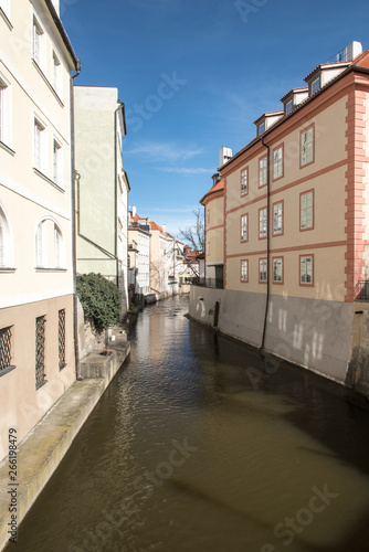 Cerovka stream with houses around and blue sky in Praha city in Czech republic © honza28683