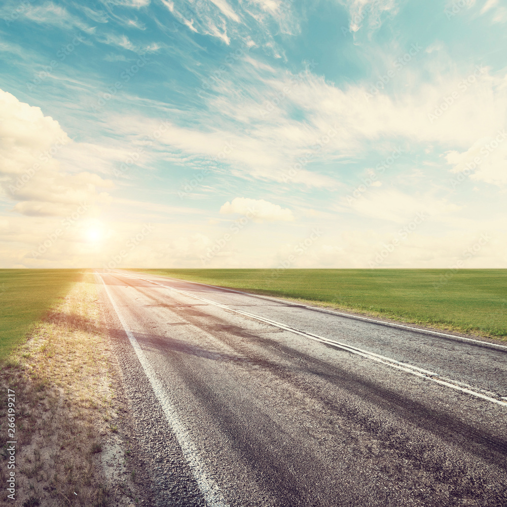 Summer road, sky, sun and clouds