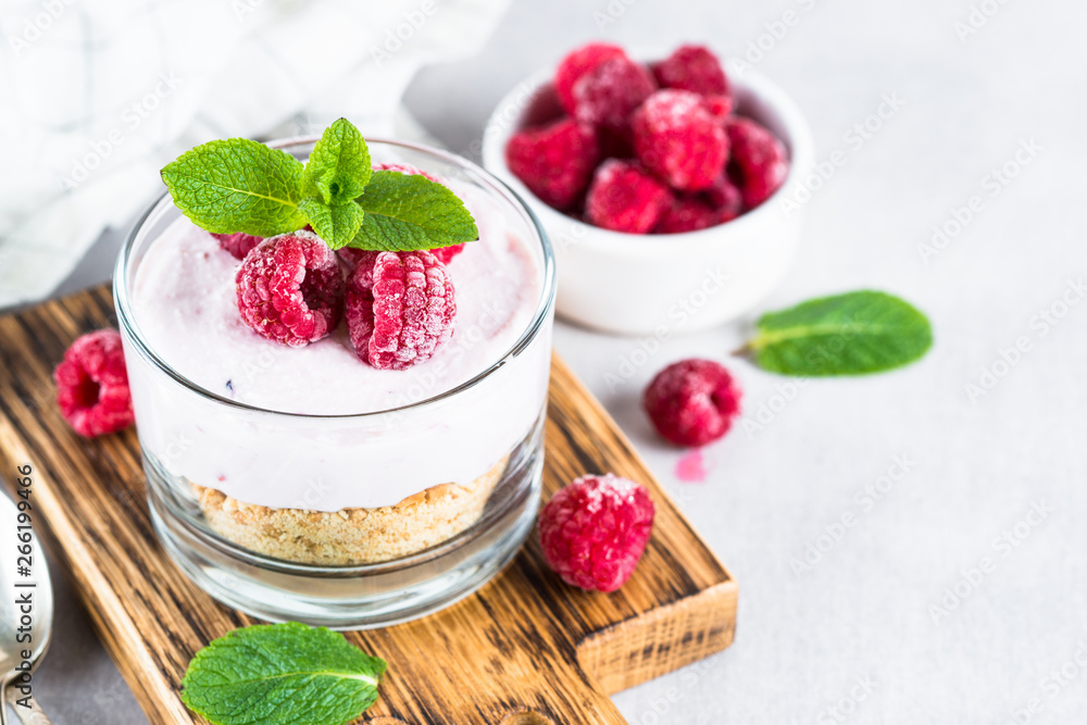 No baked cheesecake with raspberry in glass jar. No baked cheesecake with raspberry in glass jar.
