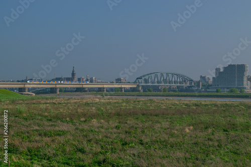 Dutch passenger train passing a bridge © Daniel Doorakkers