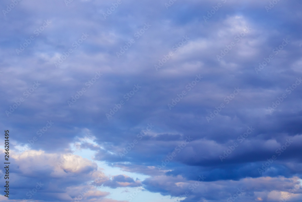 Fototapeta premium The sky in the clouds with the light of the sunset. The texture of the clouds, the background image.