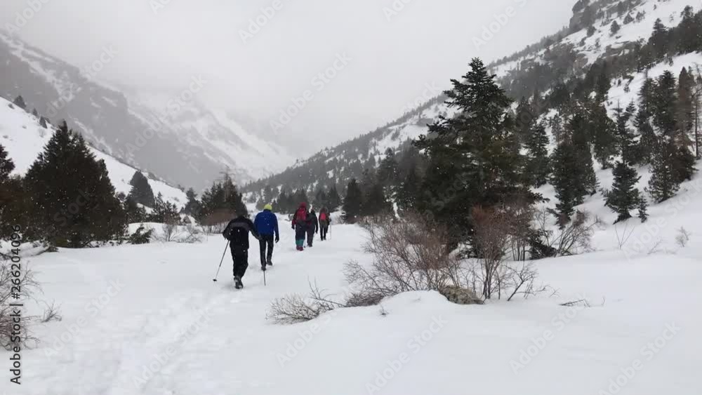 Mountaineers hiking at snowy day in Aladaglar National Park, Nigde, Turkey. Aladaglar is most important mountain range in Turkey. Mountaineers hiking at snowy day in Aladaglar National Park, Nigde, Turkey. Aladaglar is most important mountain range in Turkey.