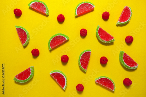 Fototapeta Naklejka Na Ścianę i Meble -  Fruit jelly segments in the form of watermelon on yellow