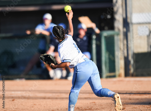 High School Softball Players making plays during a game