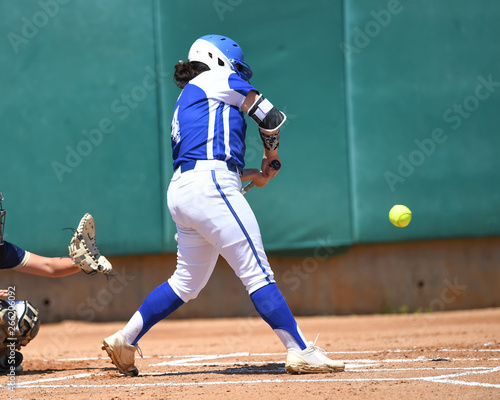 High School Softball Players making plays during a game