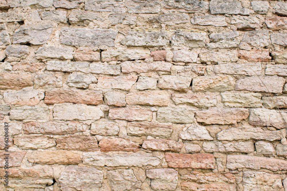 Fototapeta premium Old wall of stones. Stonework texture. Grunge background.