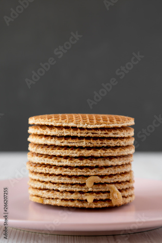 Wallpaper Mural Stack of homemade Dutch stroopwafels with honey-caramel filling on pink plate, side view. Close-up. Torontodigital.ca
