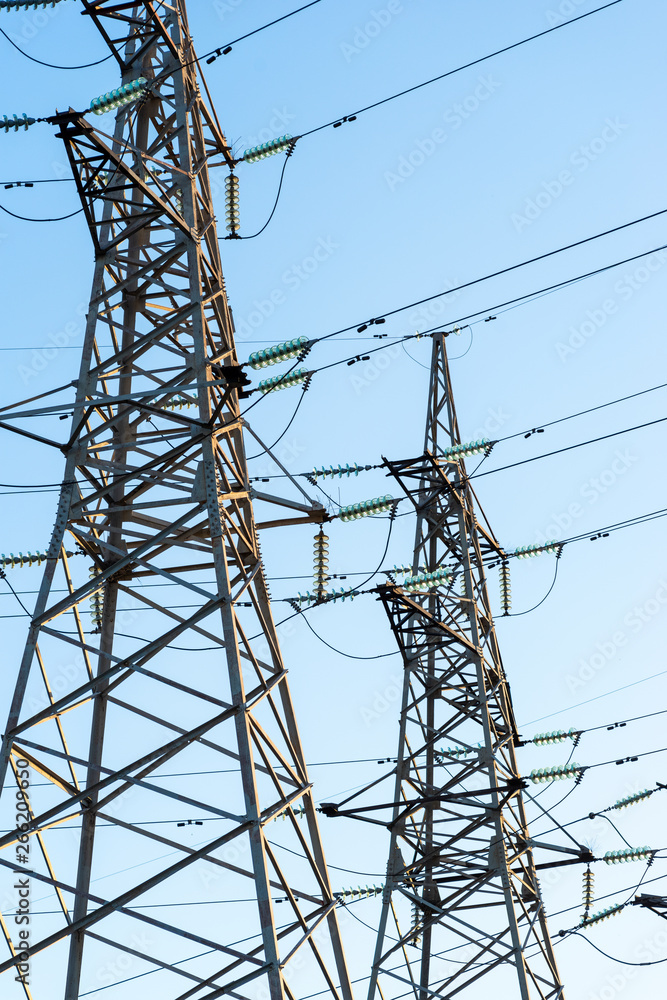 two big power lines against a blue sky two big power lines against a blue sky