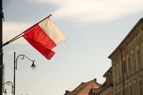 Polish flag waving on the city street