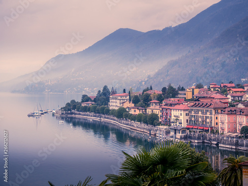 Fototapeta Naklejka Na Ścianę i Meble -  Image of a panorama view of cannero riviera at lake maggiore in italy on a foggy cloudy day