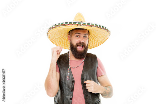 Mexican party concept. Guy happy cheerful festive outfit ready to celebrate. Mexican melody drives him. Man bearded cheerful guy wear sombrero mexican hat. Celebrate traditional mexican holiday