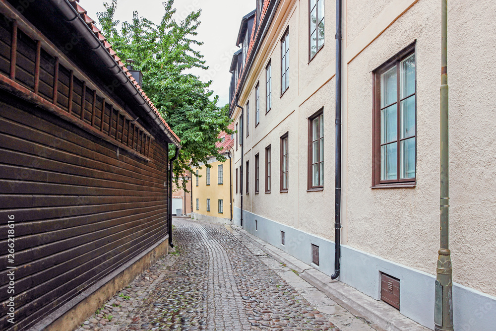 small stone street with old buildings in Visby old town, Sweden 