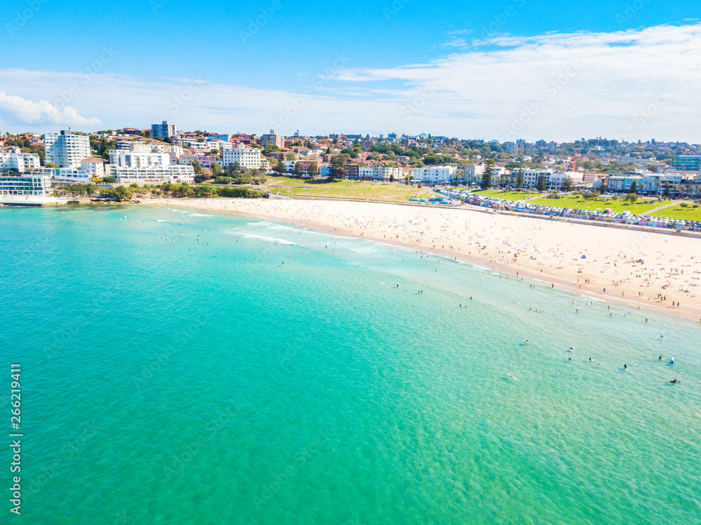 An aerial view of Bondi Beach in Sydney, Australia on a busy day with blue water