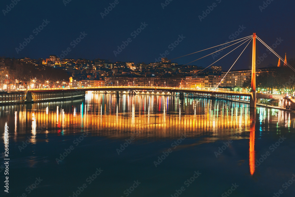 Fototapeta premium Night view on Passerelle du Palais de Justice and Saone river. Lyon, France