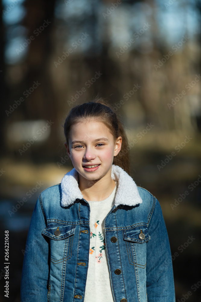 Schoolgirl's portrait in the spring outdoors. Schoolgirl's portrait in the spring outdoors.