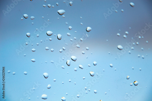 small drops of water on the glass, the concept of rainy weather