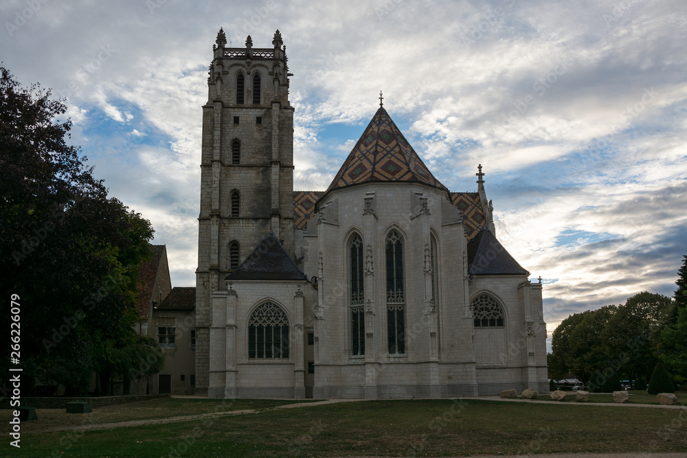 Bell tower and back side of the Royal Monastery of Brou in the evening in Bourg-en-Bresse, France - Monastère Royale de Brou.