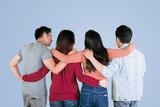 Four best friends embrace each other on studio