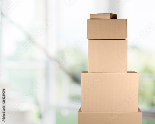 Man with cardboard boxes on background © BillionPhotos.com