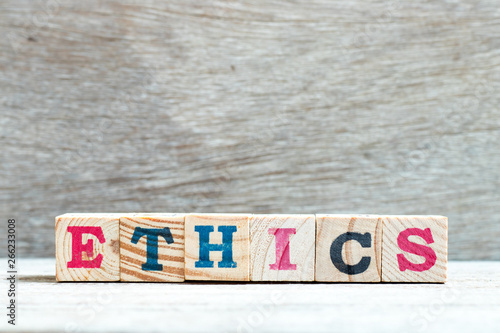 Bild auf Leinwand Alphabet letter block in word ethics on wood background
